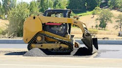 A compact track loader on a job site A compact track loader on a job site
