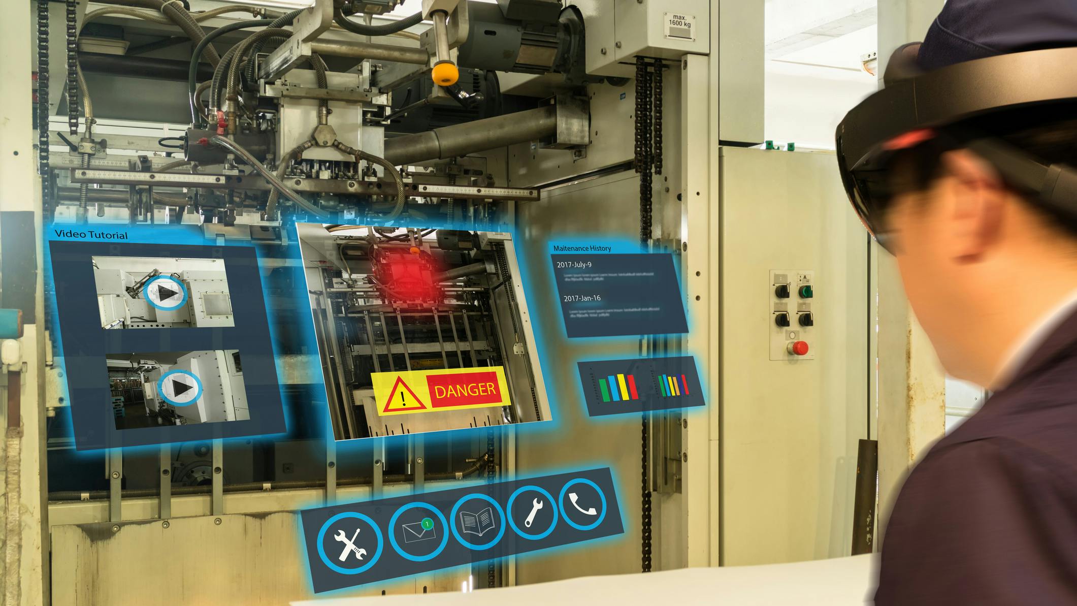 A maintenance worker wearing augmented reality glasses to assess a machine