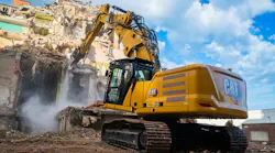 Caterpillar 330 UHD hydraulic excavator demolishing a building