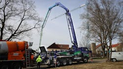 The battery-electric concrete pump truck from Volvo Trucks and Putzmeister working on a job site The battery-electric concrete pump truck from Volvo Trucks and Putzmeister working on a job site