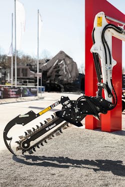 An attachment on the end of an excavator arm An attachment on the end of an excavator arm