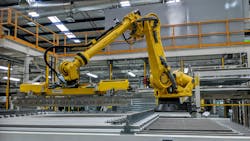 A large robot working in a manufacturing facility A large robot working in a manufacturing facility