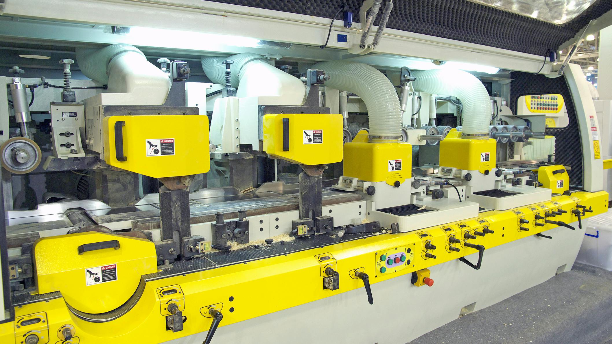 A large woodworking machine in a manufacturing facility