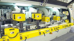 A large woodworking machine in a manufacturing facility A large woodworking machine in a manufacturing facility