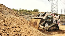 The Bobcat T7x all-electric compact track loader working on a job site The Bobcat T7x all-electric compact track loader working on a job site