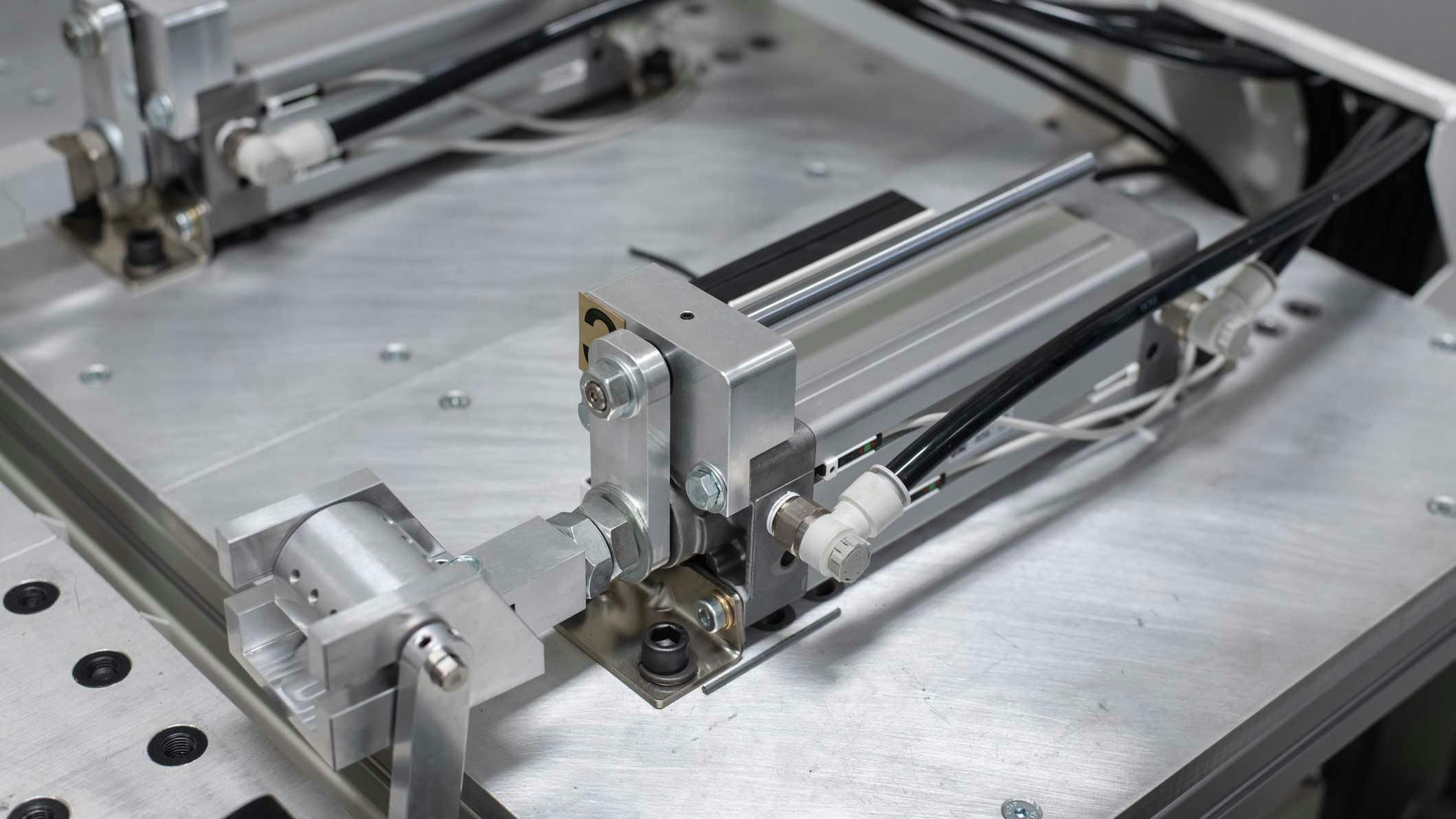A pneumatic cylinder installed on an industrial machine