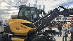 A close up view of hydraulic cylinders on the arm of an excavator A close up view of hydraulic cylinders on the arm of an excavator