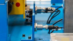 A proximity sensor installed in an industrial machinery application A proximity sensor installed in an industrial machinery application