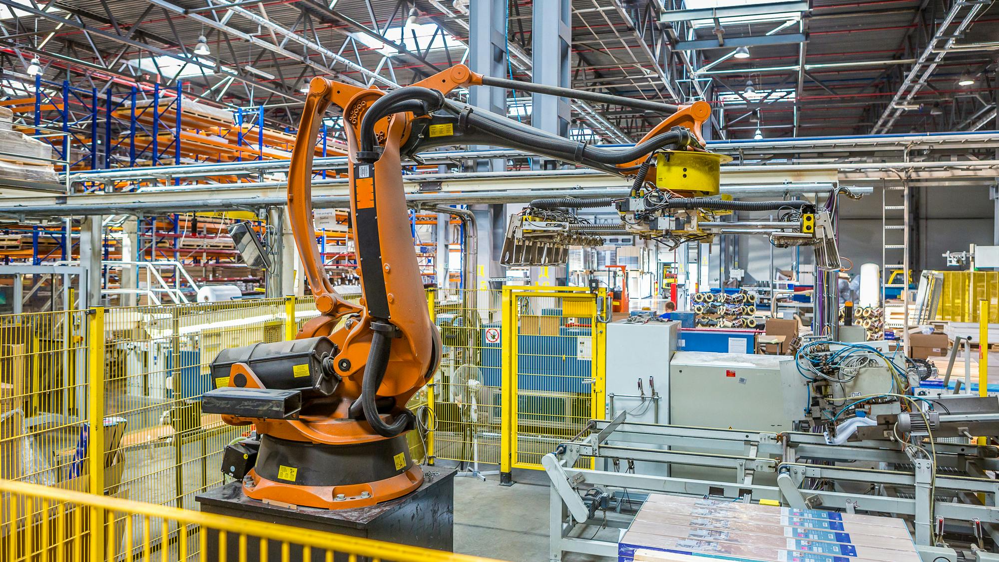 An industrial robot working in a production facility
