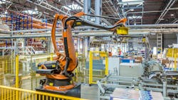 An industrial robot working in a production facility An industrial robot working in a production facility