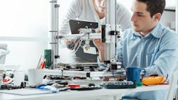 Engineers assessing a design Engineers assessing a design