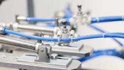 Close up view of a pneumatic valve and piston Close up view of a pneumatic valve and piston