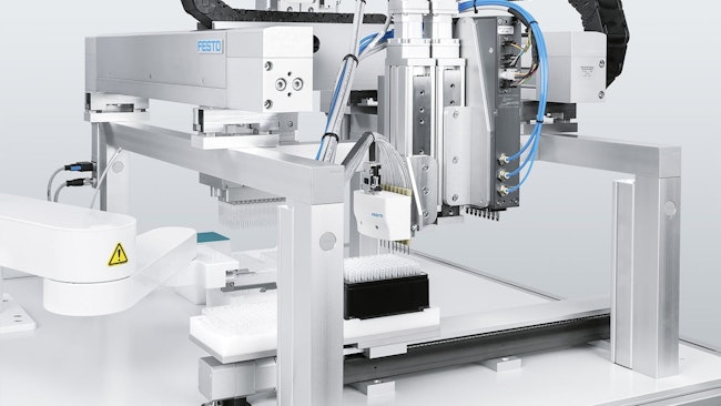 Close up of automated sampling system in laboratory utilizing pneumatic and electric technologies
