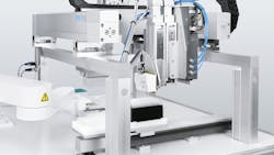 Close up of automated sampling system in laboratory utilizing pneumatic and electric technologies Close up of automated sampling system in laboratory utilizing pneumatic and electric technologies