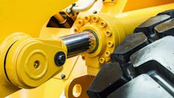 A close up view of a hydraulic cylinder on a piece of construction equipment A close up view of a hydraulic cylinder on a piece of construction equipment