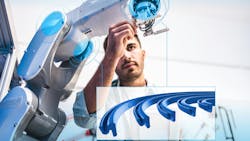 A man working on a robot with various seals pictured in the foreground A man working on a robot with various seals pictured in the foreground