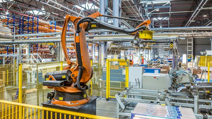 An industrial robot working in a production facility