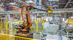 An industrial robot working in a production facility An industrial robot working in a production facility