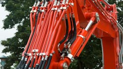A close up view of hydraulic components on a construction machine A close up view of hydraulic components on a construction machine