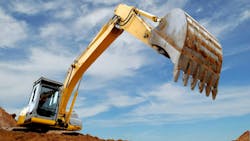 A view of the front of an excavator getting ready to dig dirt A view of the front of an excavator getting ready to dig dirt