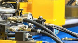 Hydraulic hoses and other components on an industrial machine Hydraulic hoses and other components on an industrial machine