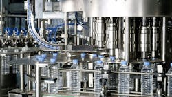 An automated bottling line in a production facility An automated bottling line in a production facility