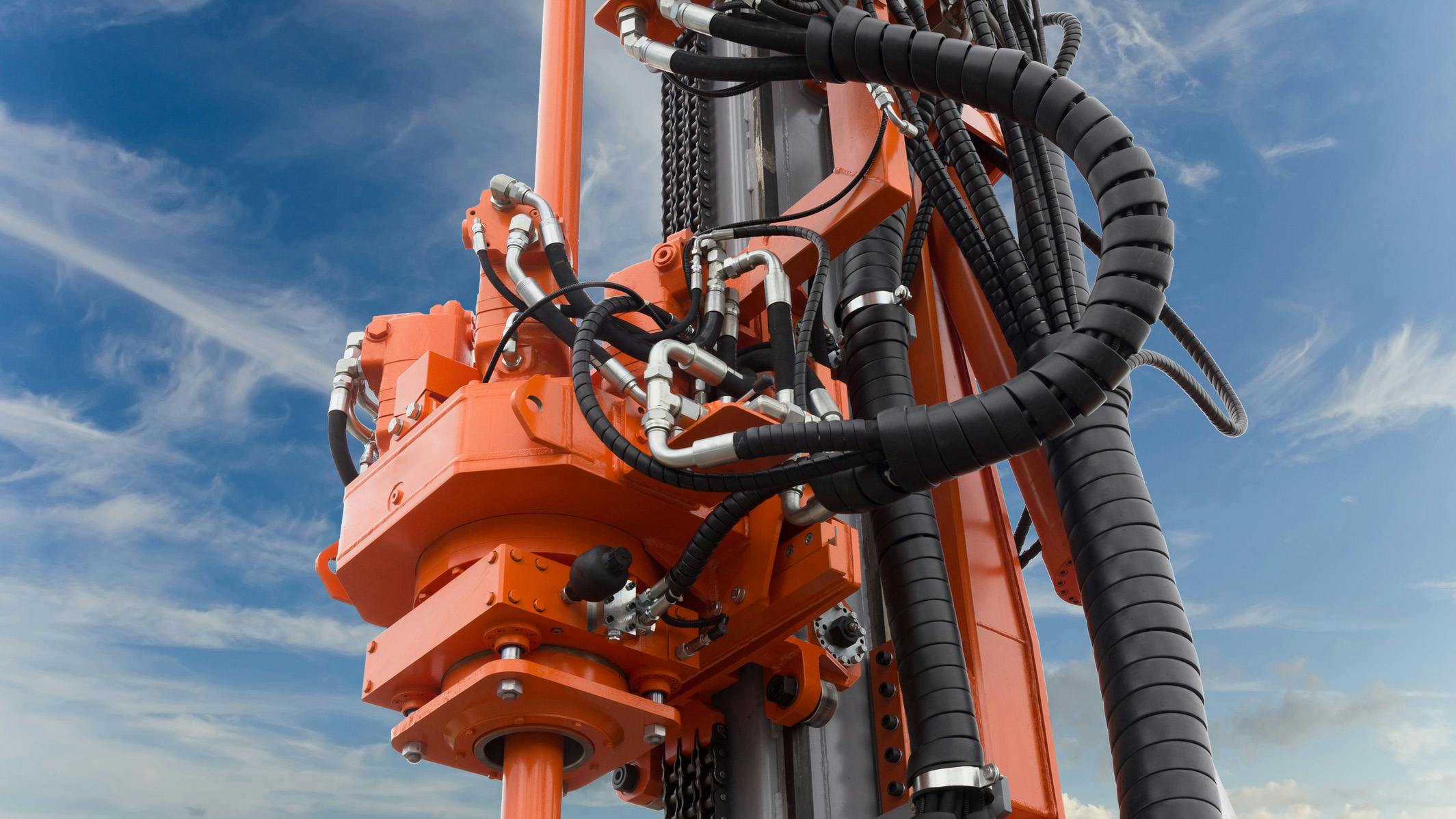 Close up view of hydraulic components on drilling machine