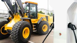 Wheel loader next to a charging station to conceptualize electrification of heavy equipment Wheel loader next to a charging station to conceptualize electrification of heavy equipment