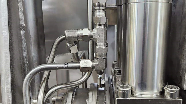 Close up of hydraulic components part of a custom system design for a hydraulic elevator