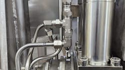 Close up of hydraulic components part of a custom system design for a hydraulic elevator Close up of hydraulic components part of a custom system design for a hydraulic elevator