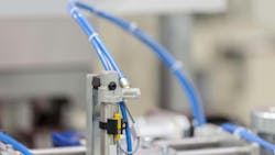 Close up on a pneumatic piston on an industrial machine Close up on a pneumatic piston on an industrial machine