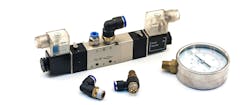 Pneumatic valves, gauges and fittings on a white background Pneumatic valves, gauges and fittings on a white background