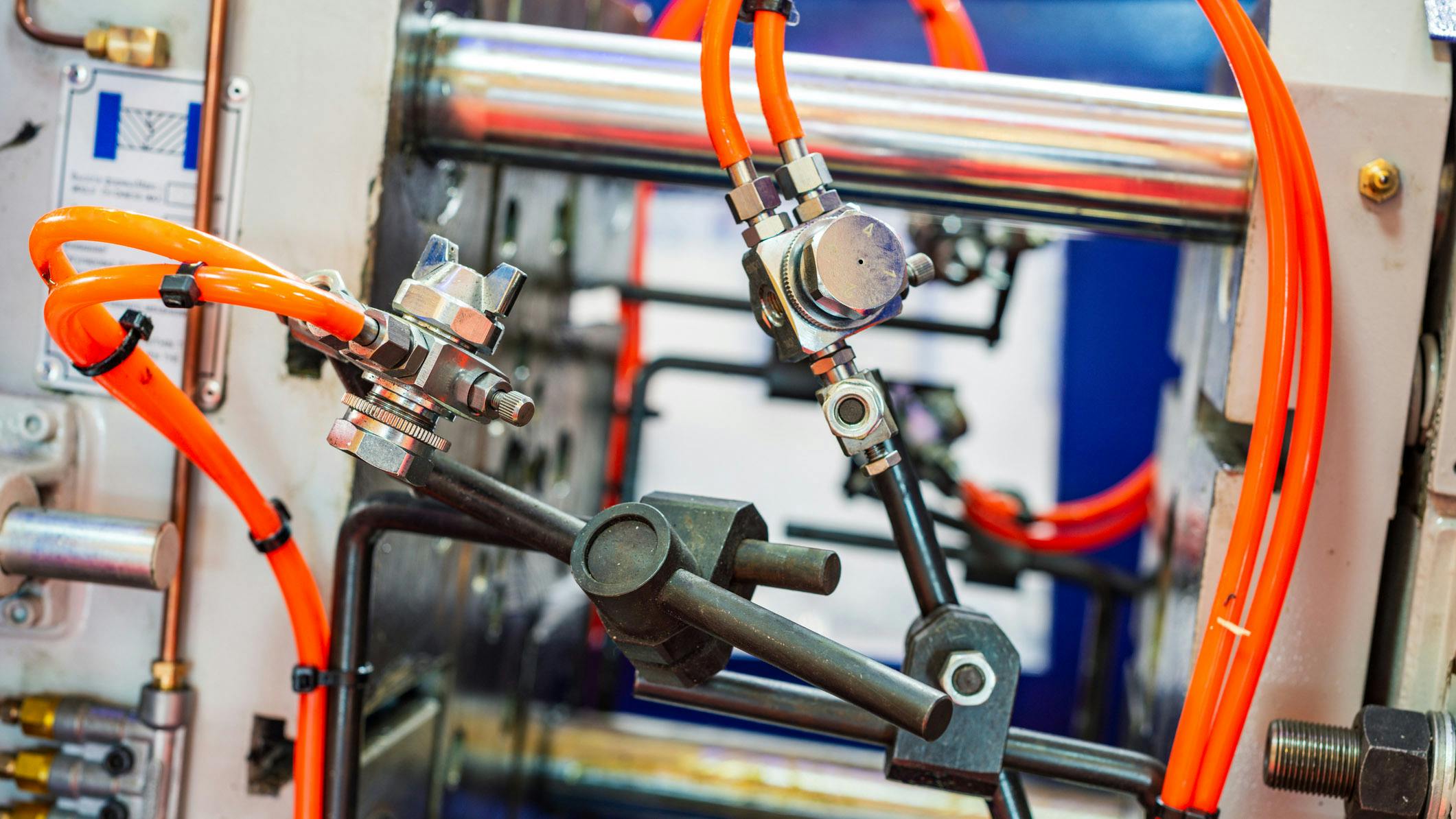 Close up of pneumatic components on industrial machinery