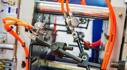 Close up of pneumatic components on industrial machinery Close up of pneumatic components on industrial machinery