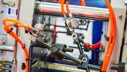 Close up of pneumatic components on industrial machinery Close up of pneumatic components on industrial machinery