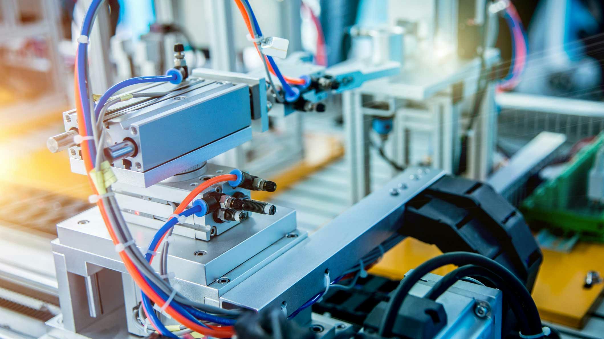 Industrial machine setup with pneumatics and other components visible