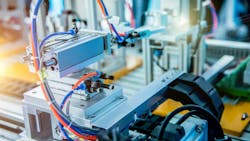 Industrial machine setup with pneumatics and other components visible Industrial machine setup with pneumatics and other components visible