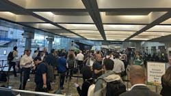 Line of attendees waiting to pick up badges at The Battery Show 2025 Line of attendees waiting to pick up badges at The Battery Show 2025