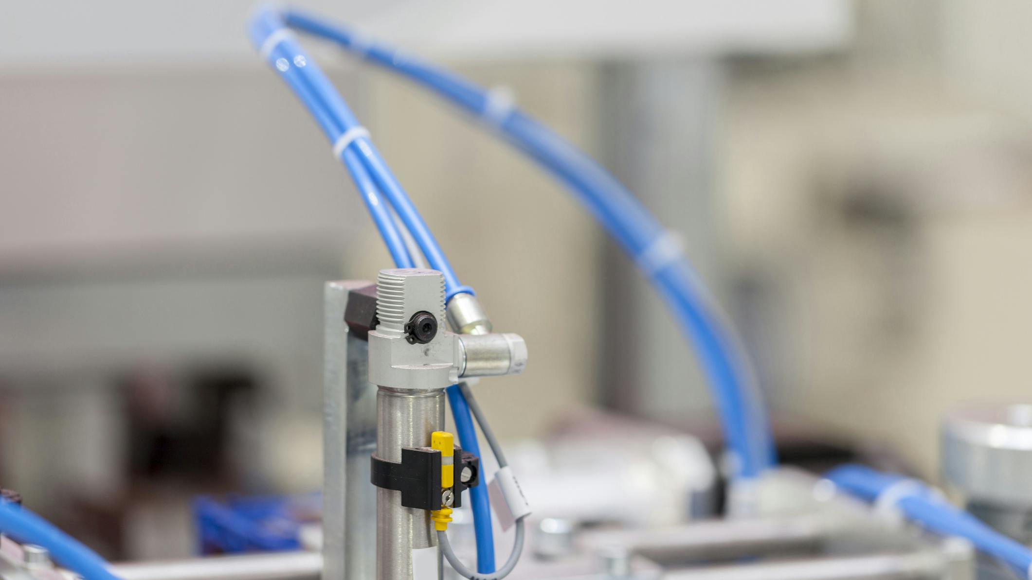 Close up on pneumatic components installed on industrial machinery