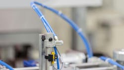 Close up on pneumatic components installed on industrial machinery Close up on pneumatic components installed on industrial machinery