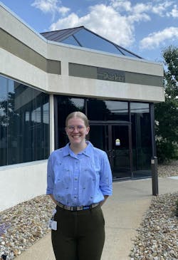 Intern Courtenay Mackey standing in front of a Parker Hannifin office building Intern Courtenay Mackey standing in front of a Parker Hannifin office building