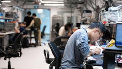 Employees Conducting Tests in a Delta-Q Laboratory Employees Conducting Tests in a Delta-Q Laboratory