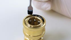 Master Bond Supreme 121AOND being applied to a component Master Bond Supreme 121AOND being applied to a component