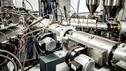 Extrusion press with fluid power and other components visible Extrusion press with fluid power and other components visible