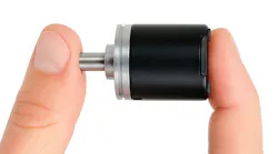 The POSITAL 20 mm Diameter IXARC Multiturn Encoder being held between 2 fingers to show its compact size