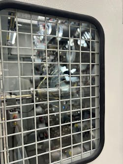 View inside wire braiding machine at ContiTech Aguascalientes manufacturing facility View inside wire braiding machine at ContiTech Aguascalientes manufacturing facility