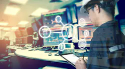 Technician looking at tablet with icons depicting industrial digital tools for uptime