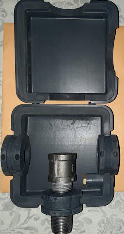 The two-part clamshell box open to see its interior and how it fits onto pipes The two-part clamshell box open to see its interior and how it fits onto pipes