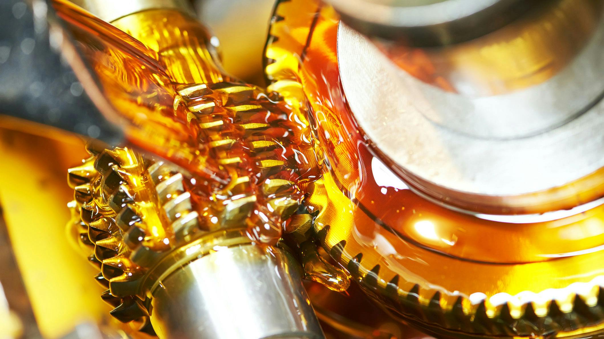 Lubricant being poured on geared components