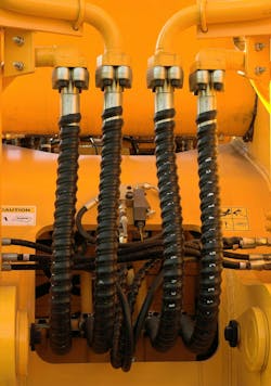 Hydraulic hoses and other components on a machine Hydraulic hoses and other components on a machine